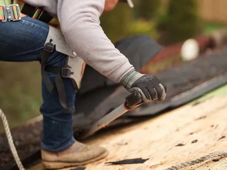 Sunnyside Roofing professional working on a roof ventilation system