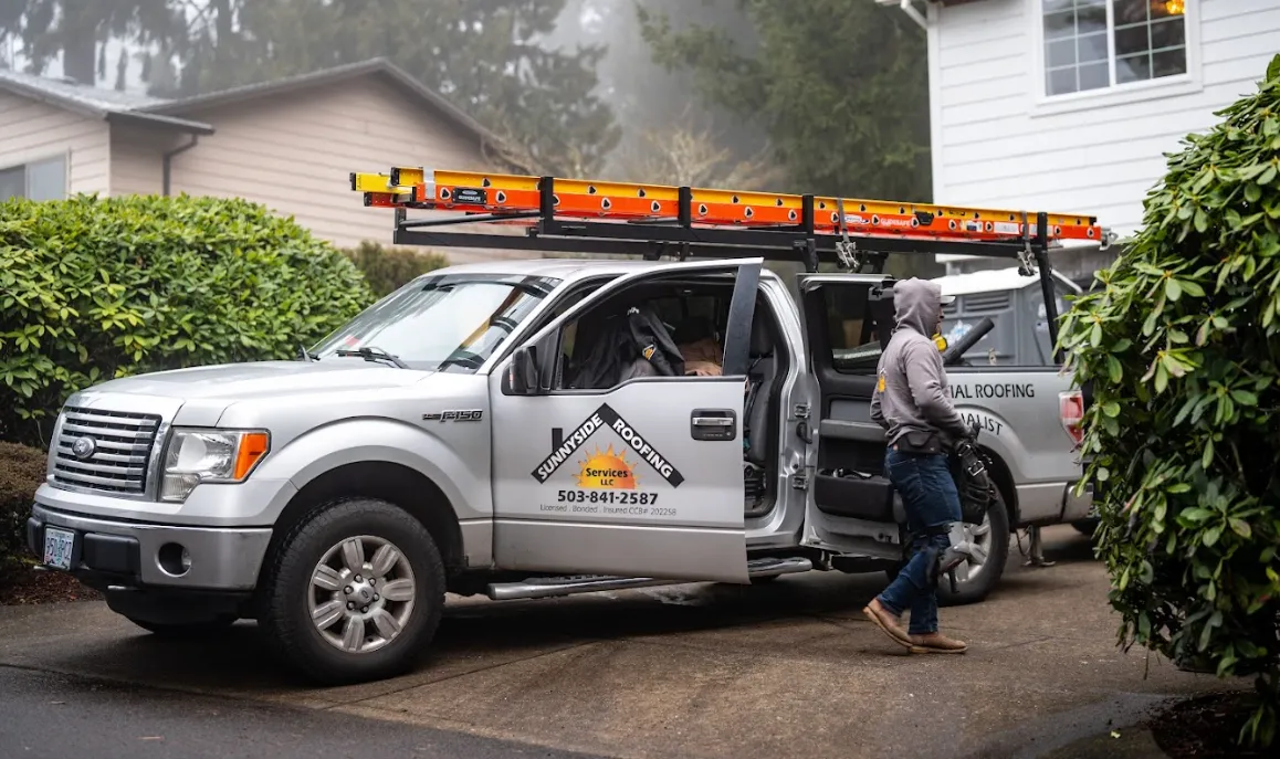 Sunnyside Roofing truck and technician working on residential home
